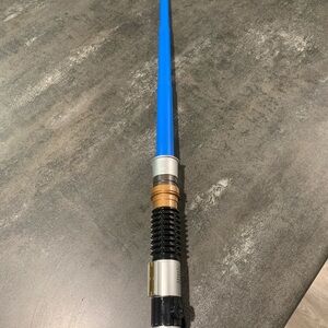 Hasbro Blue and Black Toy Lightsaber